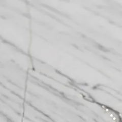 A fine fissure cutting across the vein in marble