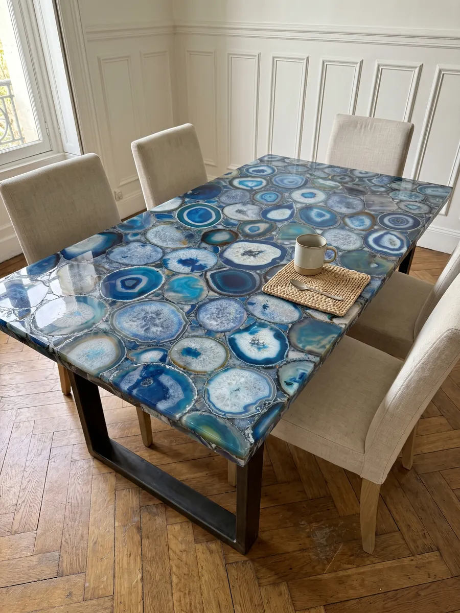 Dining table with a blue agate top on a steel base: a mosaic of blue agate slices with concentric rings and white centers