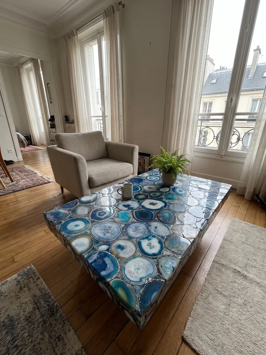 Coffee table with a blue agate top in a living room: a mosaic of blue agate slices with concentric rings and white centers