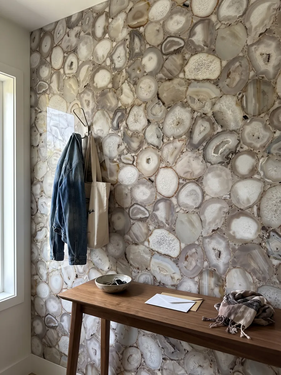 Entryway wall clad in Gray Agate with a narrow console: slices of beige and white gray agate, neutral tones