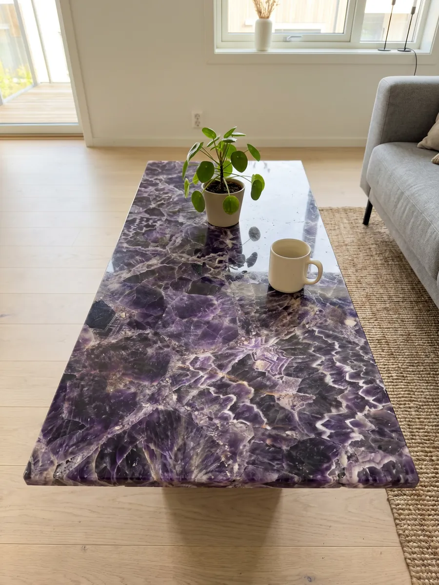 Coffee table with an amethyst top in a living room: dark violet crystals with white and lilac zigzag bands