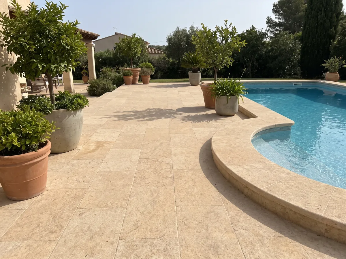 Terrace floor and pool coping in Santafiora Havana sandstone with planters: a warm cream tone with diffuse golden clouds and a soft sandy texture