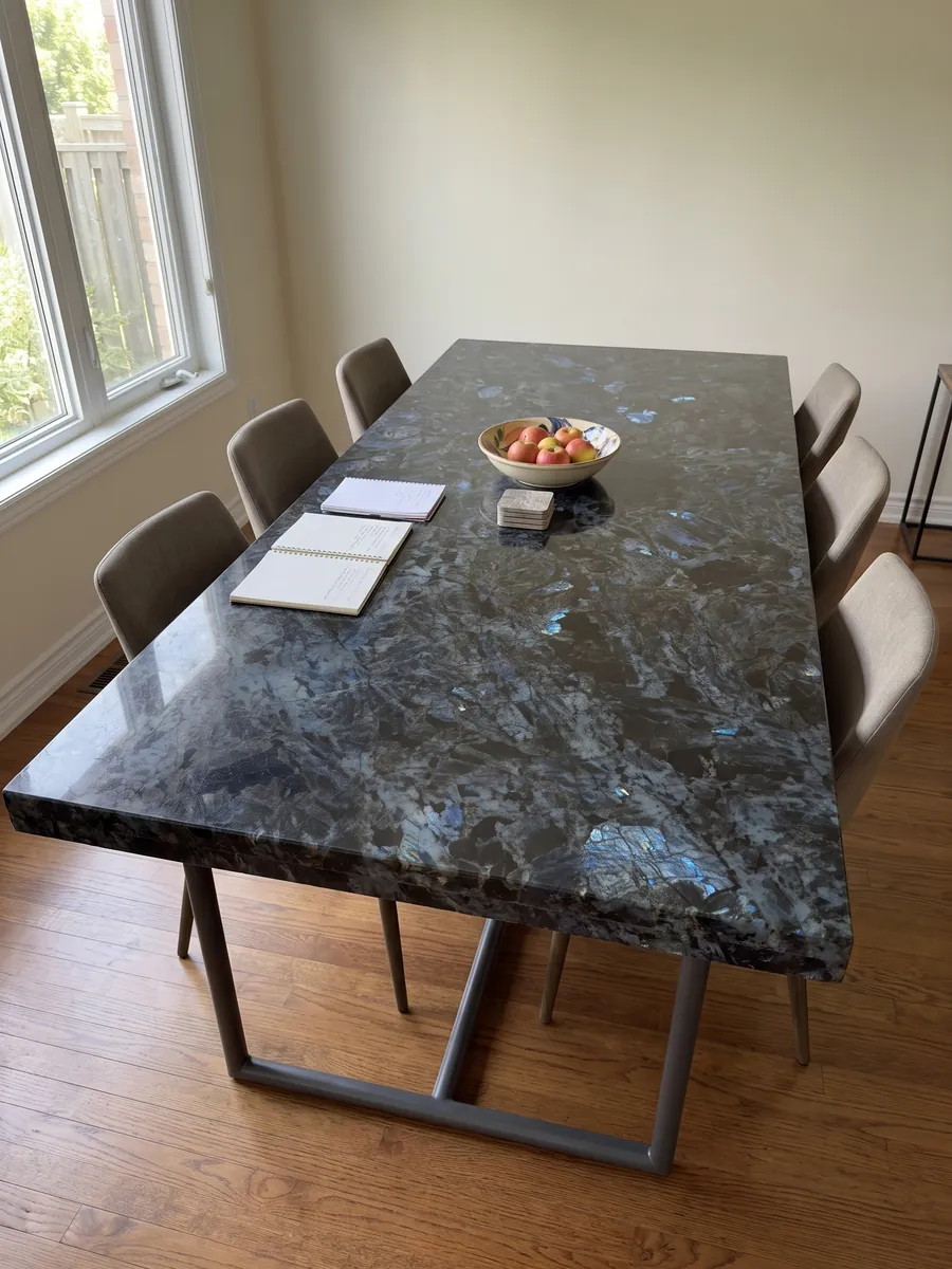 Dining table with a Lemurian black quartzite top on a steel base: black with large crystals and flashes of iridescent blue