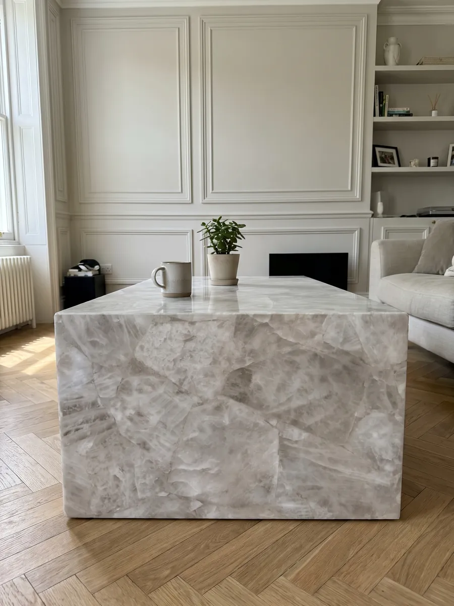 Coffee table with a White Quartz top in a living room: crystalline, soft grayish white with barely marked fragments