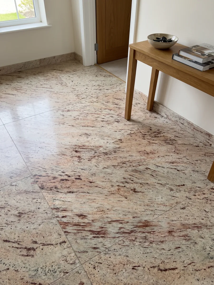 Entryway floor in large Ivory Brown beige granite slabs with natural light: ivory with reddish and burgundy horizontal strokes