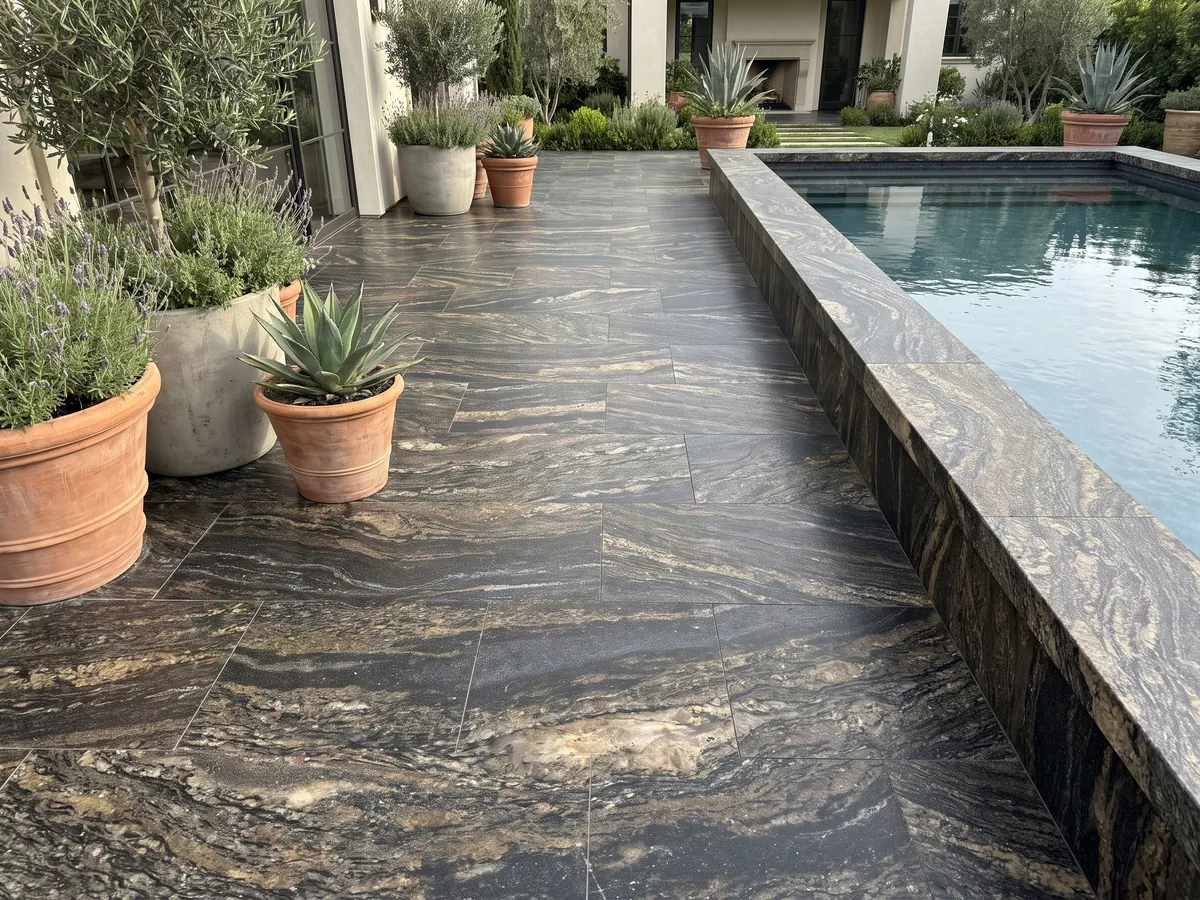 Terrace floor and pool coping in Cosmic Gold granite with planters: black with golden and bronze patches in horizontal waves