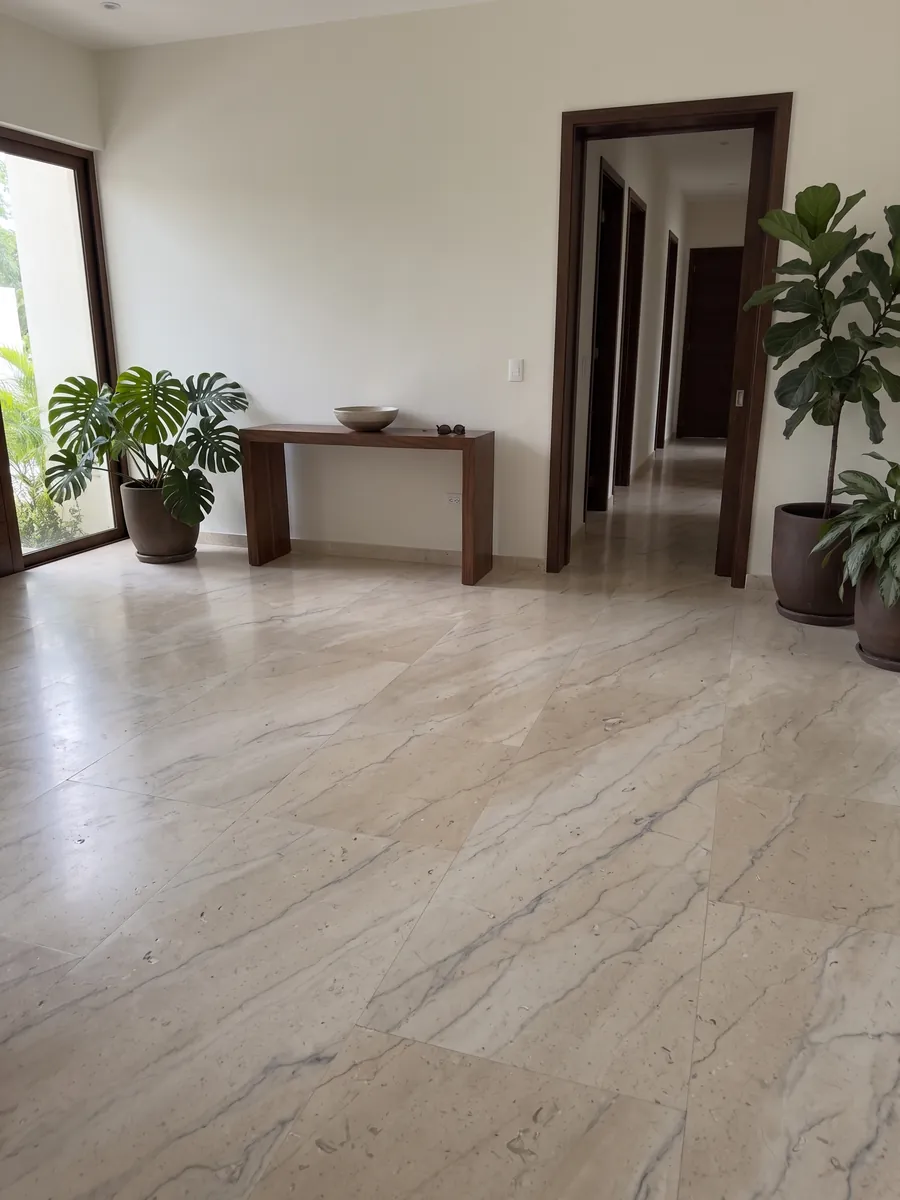 Entryway floor in large Beige Maya marble slabs with natural light: warm beige with soft gray veins and small fossils