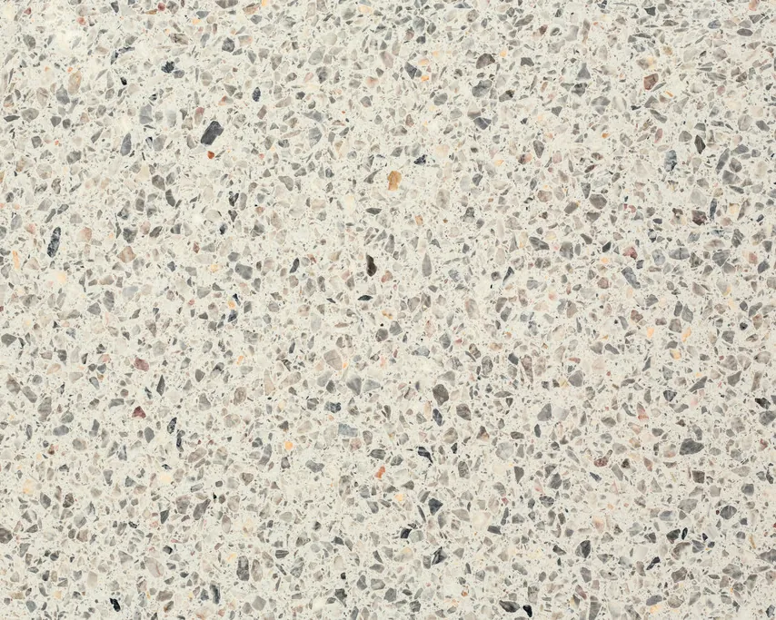 Slab of Fior di Pesco White engineered marble with resin: an ivory background with gray fragments