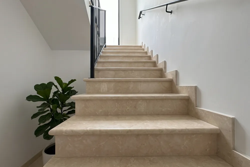 Interior staircase with Botticino marble steps
