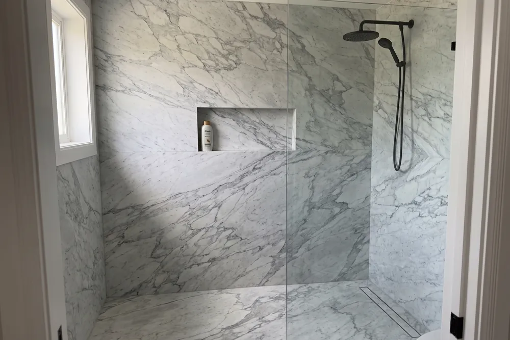 Shower with gray Arabesque marble walls