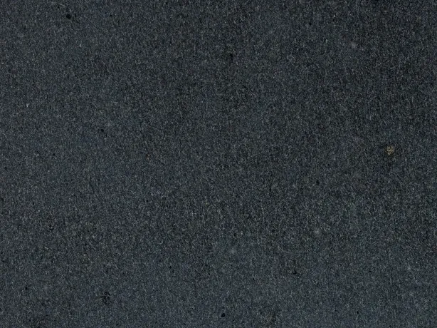 Detail of Pietra Lavica basalt: very fine anthracite gray grain with visible pores