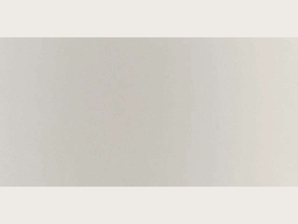Slab of Veselje engineered marble with resin: flat warm pearl gray, vein-free, with a soft gradient of light