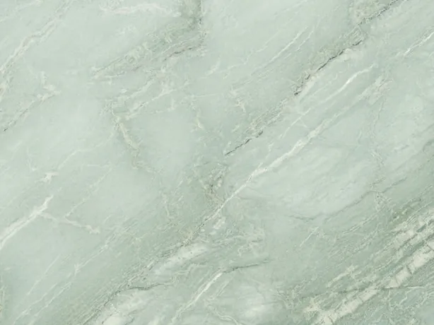 Detail of green Aquamarine quartzite: diagonal white veins and light clouds over the pale aqua