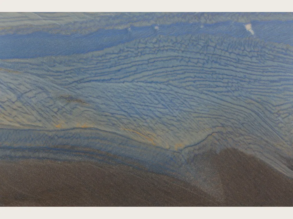 Azul Macaubas quartzite slab: lavender blue background with a wide cream band on the diagonal and ochre touches (another slab)