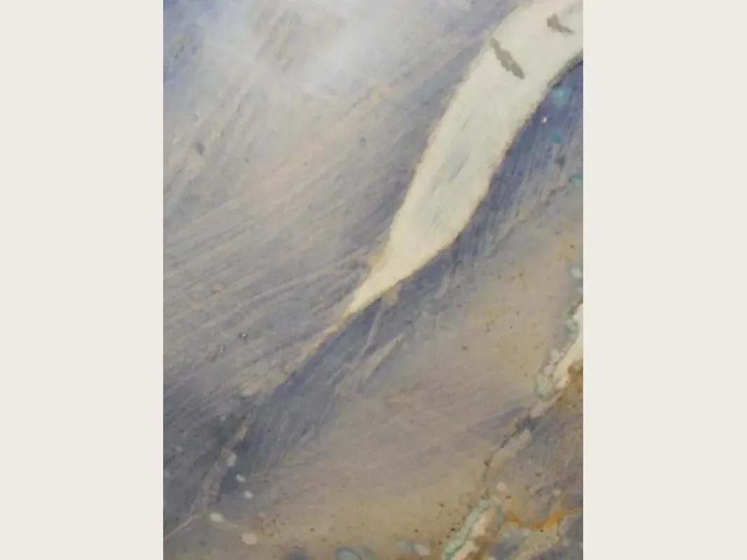 Azul Macaubas quartzite slab: lavender blue background with a wide cream band on the diagonal and ochre touches