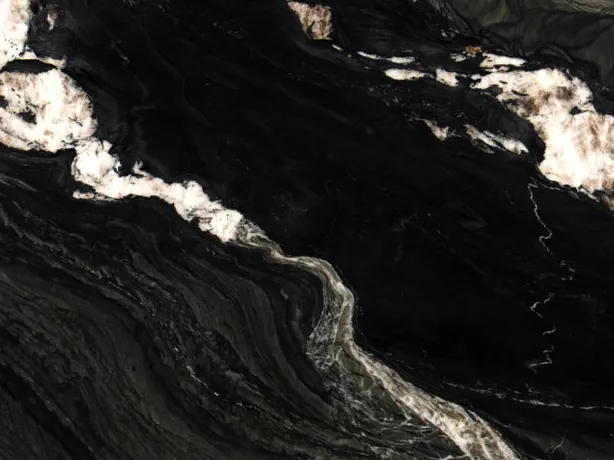 Close-up of Black Tempest quartzite: creamy white patches and gray waves on the high-gloss polish