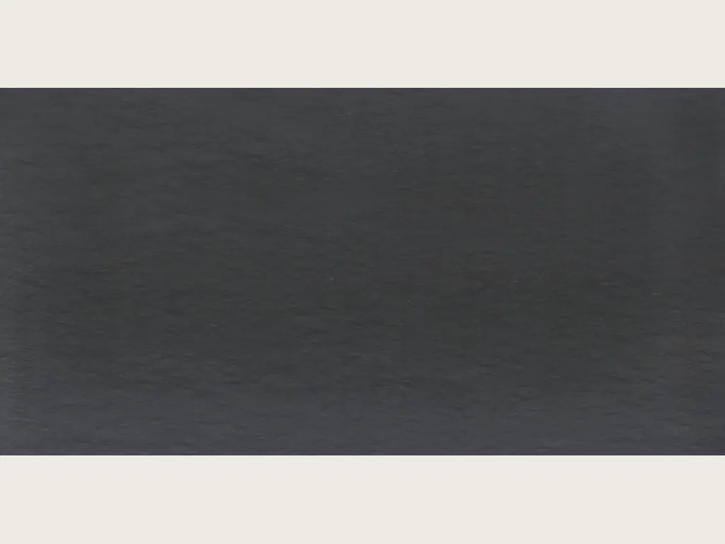 Black Vermont quartzite slab: nearly uniform anthracite gray with very faint horizontal streaks