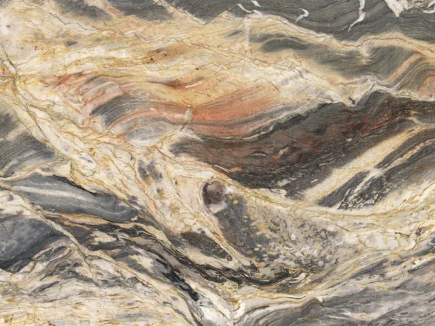 Close-up of Colorado quartzite: dense dark gray waves over the cream background