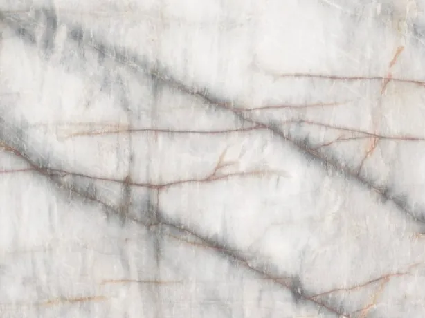 Detail of white Cristallo Black quartzite: soft dark grey veins and thin orange lines over the white