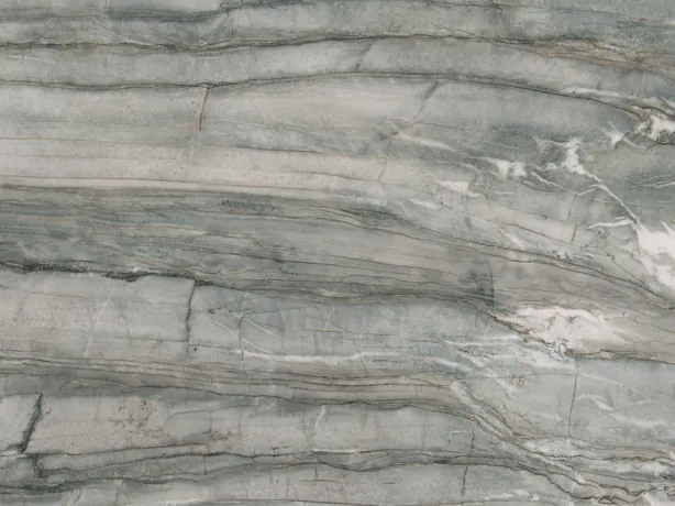 Close-up of green Cristallo Tiffany quartzite: bands of dark gray and fine white veins over the sage green