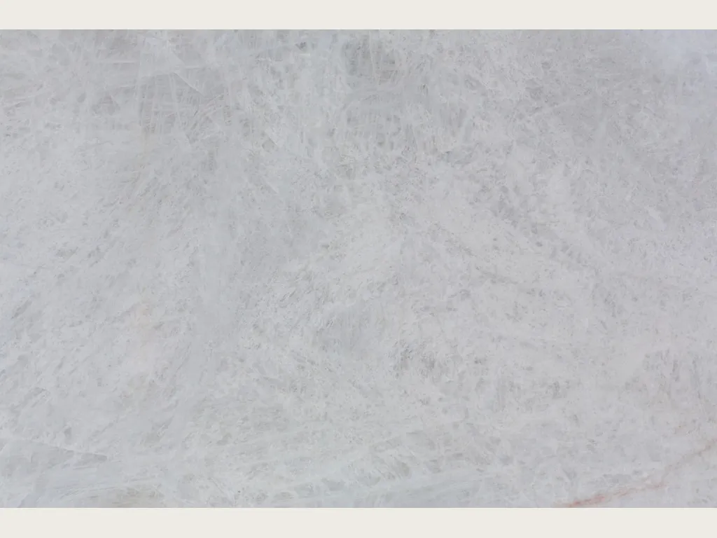 Grey Cristallo quartzite slab: very light pearl grey with soft clouds and a bright polish