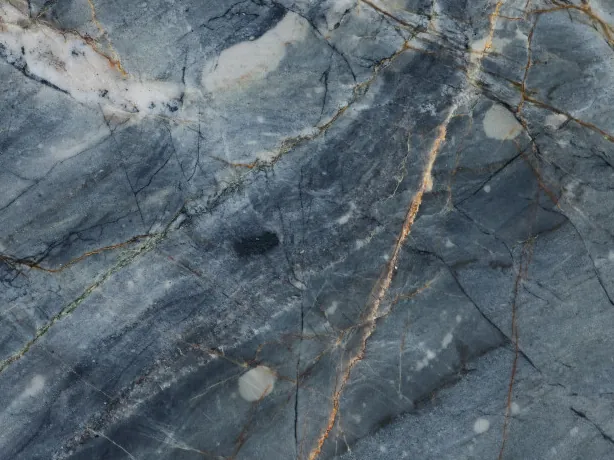 Close-up of Ijene Blue quartzite: elongated white areas and ochre veins over the glossy polish
