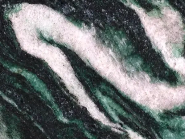 Lapponia Green Quartzite slab: dark emerald green and black background with large pinkish white waves on the diagonal