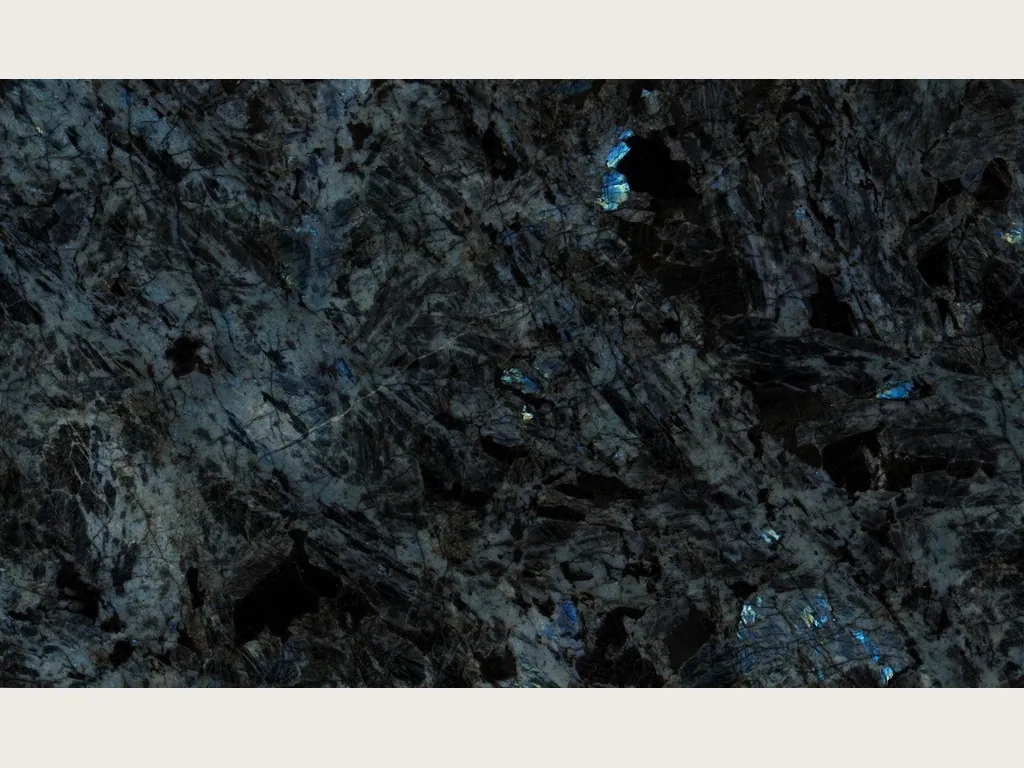 Slab of Lemurian black quartzite: blue-black background with large crystals and flashes of iridescent blue