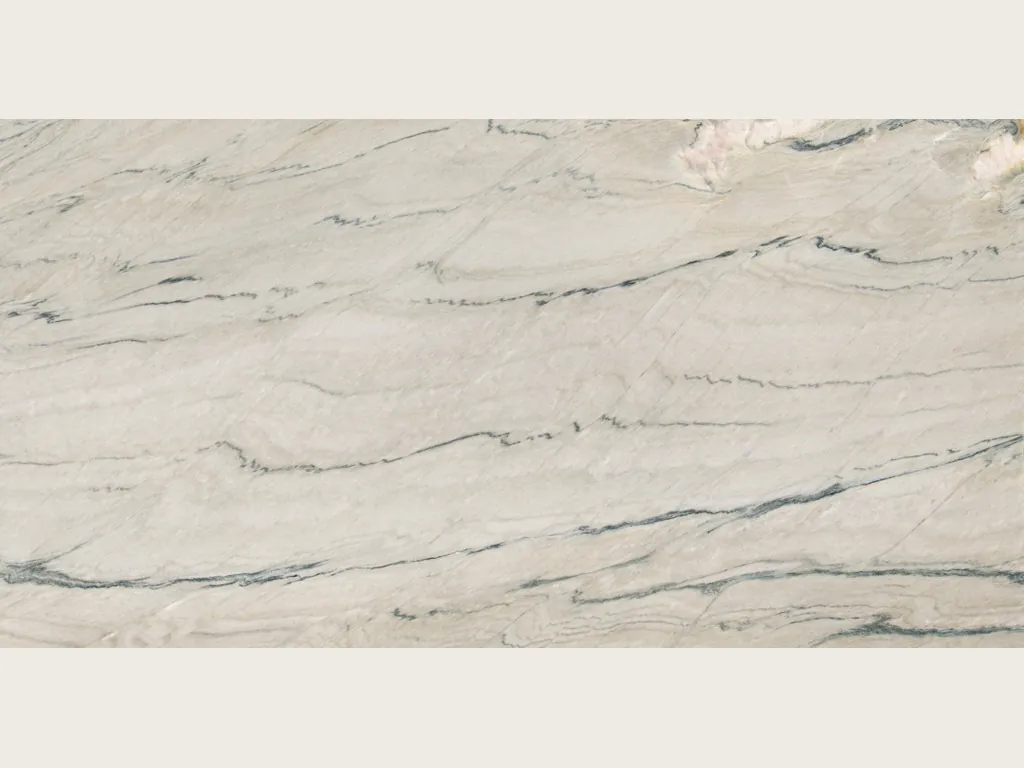 Slab of white Macaubas Fantasy quartzite: warm white background with fine gray-green lines waving horizontally
