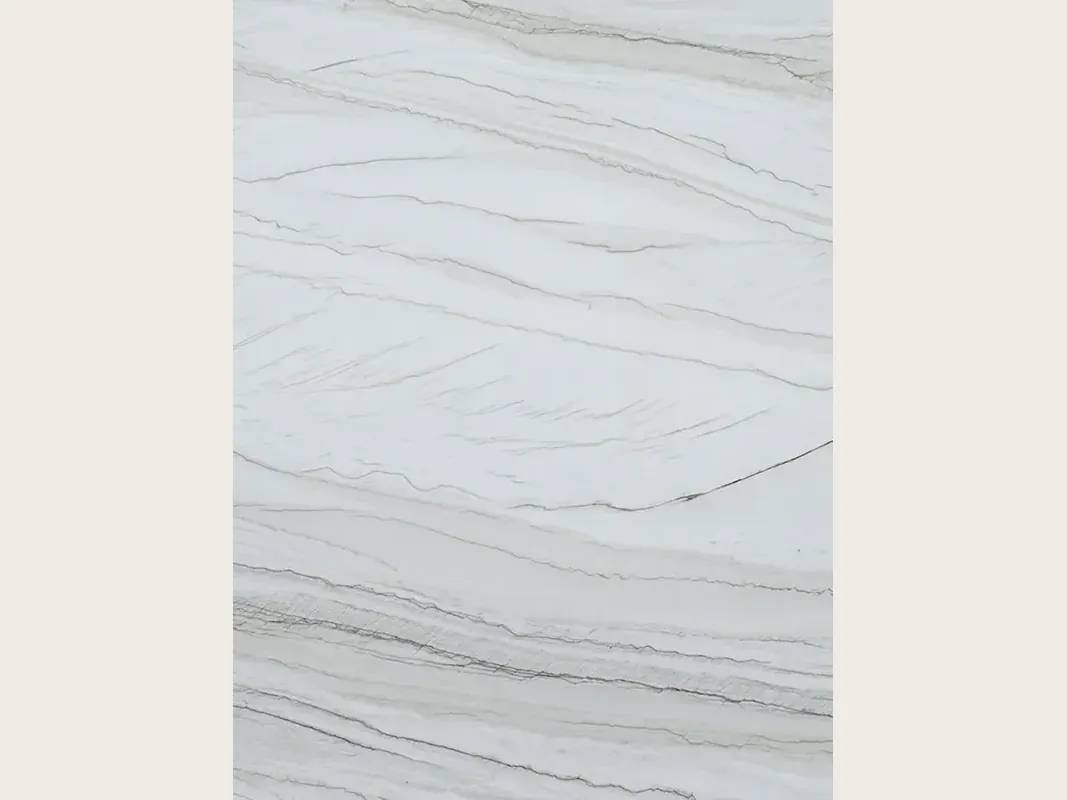 Slab of White Macaubas quartzite: a bluish white background with fine, almost horizontal dark grey lines