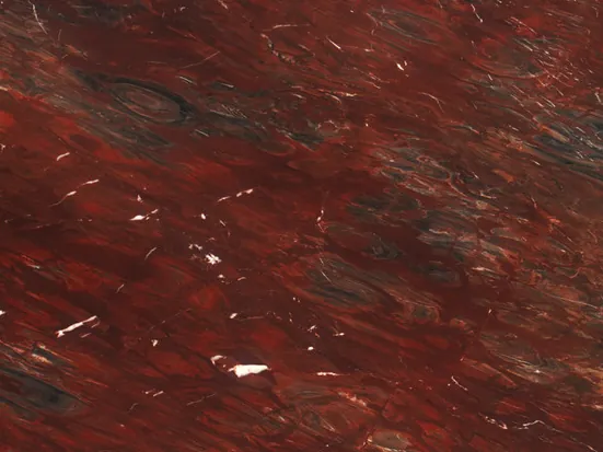 Detail of Napoleon Bordeaux red quartzite: white streaks and dark areas over the wine, with a polished shine