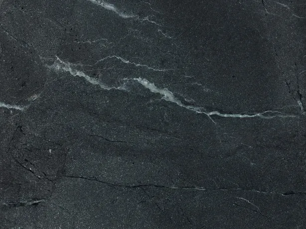 Detail of Negresco Quartzite: fine white veins over the polished shine