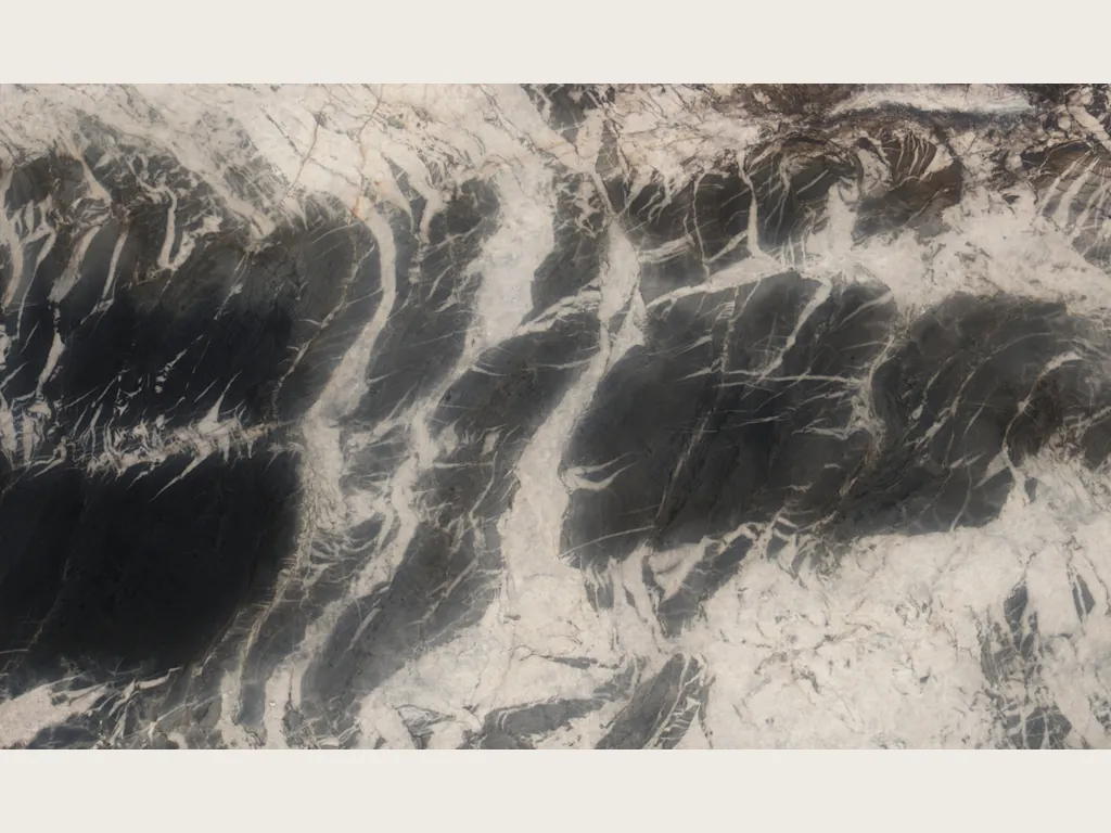 Ocean Storm black quartzite slab: cream background with vertical black brushstrokes and a brown edge
