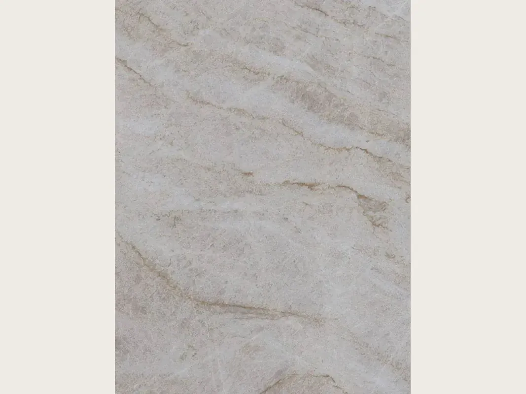 Slab of beige Taj Mahal quartzite: light beige background with soft caramel veins in a diagonal