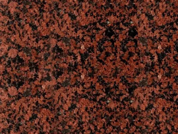 Balmoral Red Granite slab: brick red background with black dots spread evenly and no veins