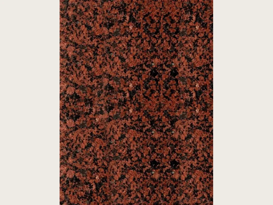 Red Balmoral Red granite slab: brick red background with black dots spread evenly and no veins