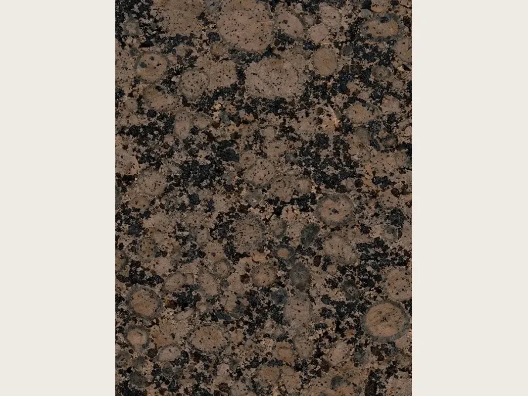 Baltic Brown granite slab: oval brown ringed grains among black dots, polished