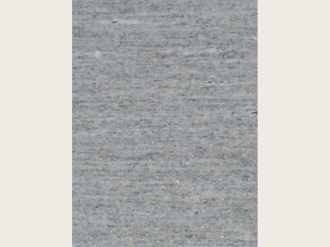 Gray Beola Bianca granite slab: light gray background with fine horizontal striping and small glints