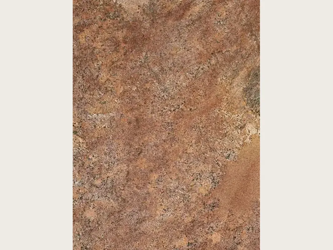Juparana Florence granite slab: grainy coppery brown with diffuse beige areas, rust touches and a polished shine