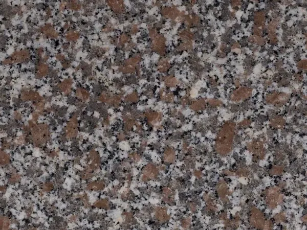 Slab of Limbara granite: pinkish-brown grain with white and black crystals