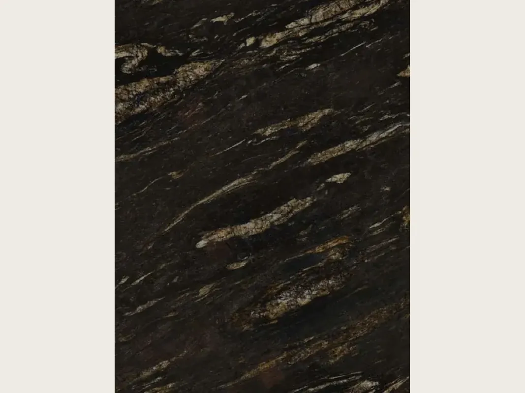 Slab of black Matrix granite: black with elongated golden and beige streaks on the diagonal