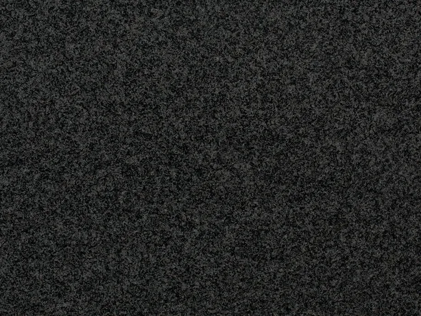 Close-up of Nero Africa black granite: light gray speckle over the polished black