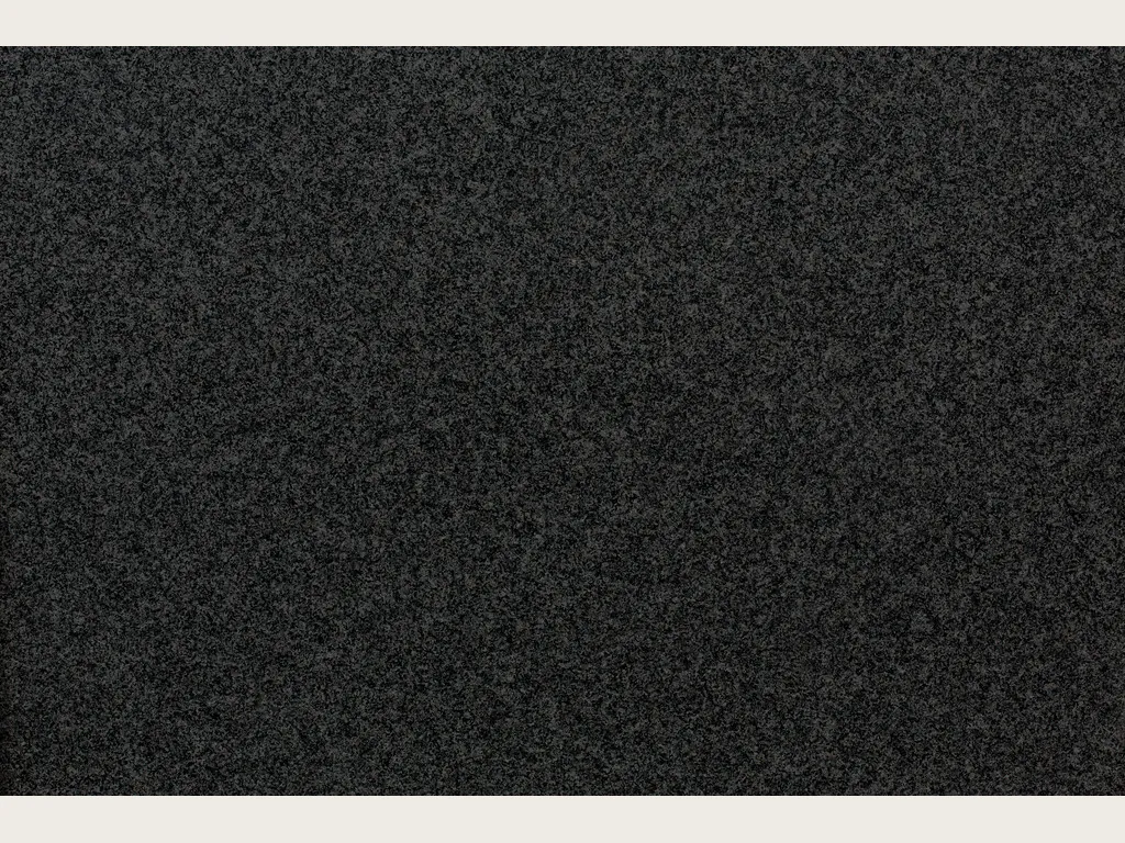 Slab of Nero Africa black granite: a uniform fine-grained grayish black with a light gray speckle