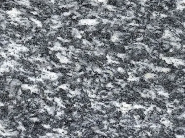 Slab of Serizzo granite: dark gray background with elongated horizontal white streaks and a glossy polish