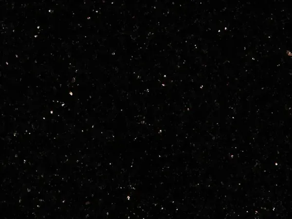 Star Galaxy granite slab: speckled black background with small shining gold and copper flecks