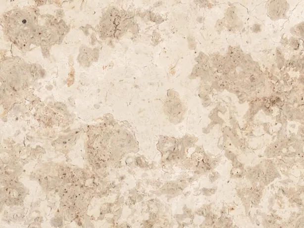 Giallo D'Istria marble detail: diffuse grayish beige clouds and small pores on the cream