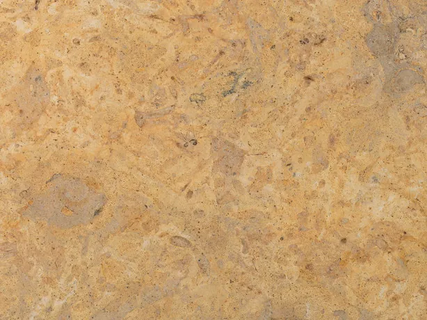 Giallo Provenza marble detail: faint clouds and stains over the golden ochre, in a matte texture