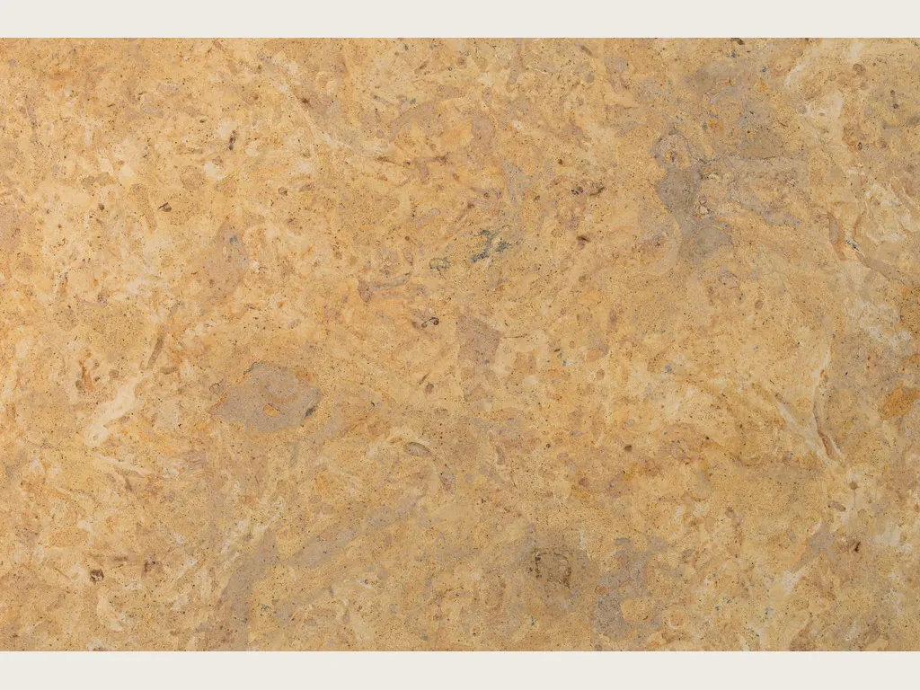 Giallo Provenza marble slab: a cloudy golden ochre background with soft stains in beige and greenish gray