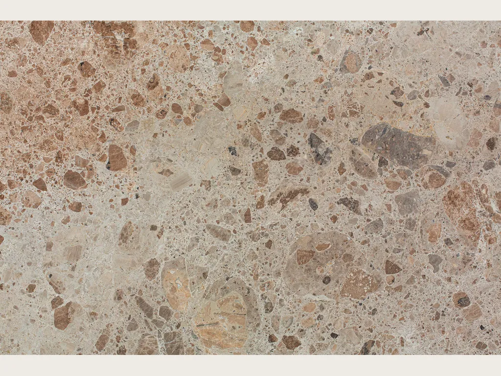 Beige Ambrosia marble slab: grayish beige matrix with rounded brown and rust fragments