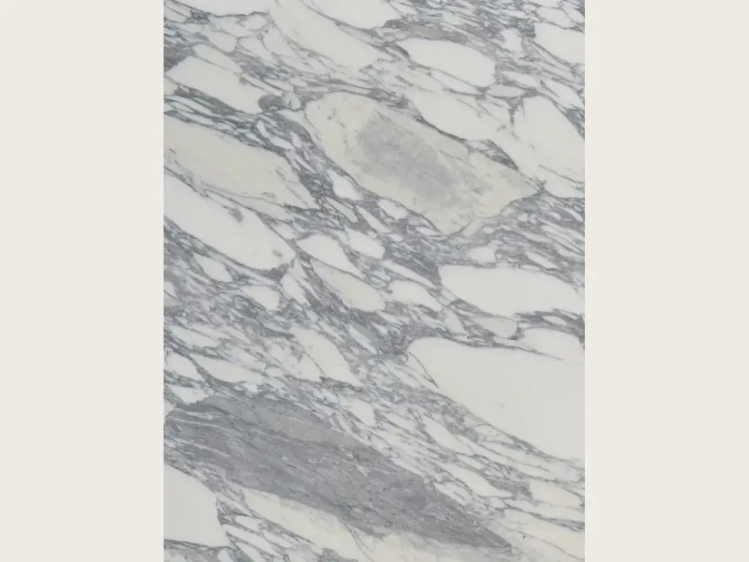 Slab of white Arabesque marble: elongated white fragments inside thick diagonal gray veins